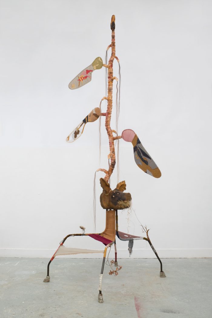 Jordan Herregraven, Stolen Harvest, 2025, linden wood, steel, textile, horse hair, apoxy clay, dried flowers, ceramic, hay, 320 x 120 x 100 cm